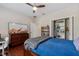 Bedroom featuring a closet, window, and a TV on a bureau at 6149 Blakeford Dr, Windermere, FL 34786