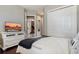 Comfortable bedroom featuring a TV, hardwood floors, a ceiling fan, and a closet at 6149 Blakeford Dr, Windermere, FL 34786