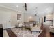 Spacious bonus room featuring a ceiling fan, hardwood floors, a ping pong table, and comfortable seating at 6149 Blakeford Dr, Windermere, FL 34786