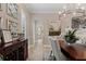 Dining room features an elaborate chandelier and view to kitchen at 6149 Blakeford Dr, Windermere, FL 34786
