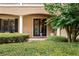 Inviting entryway with black wrought iron double doors and manicured shrubs at 6149 Blakeford Dr, Windermere, FL 34786