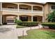 Stately home featuring a covered portico, manicured landscaping, and a paver walkway at 6149 Blakeford Dr, Windermere, FL 34786