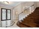 Stately foyer featuring tile flooring, staircase, wrought iron door, and neutral paint at 6149 Blakeford Dr, Windermere, FL 34786