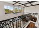 Overhead view of the living room features dark hardwood floors and an ornate railing at 6149 Blakeford Dr, Windermere, FL 34786