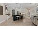 Gourmet kitchen featuring a large island with seating, stainless steel appliances, and custom cabinetry at 6149 Blakeford Dr, Windermere, FL 34786
