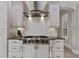 This kitchen features white cabinets, granite countertops, and stainless steel appliances at 6149 Blakeford Dr, Windermere, FL 34786