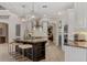 Chef's kitchen with a large island, stainless appliances, custom cabinetry, and granite countertops at 6149 Blakeford Dr, Windermere, FL 34786