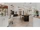 Open-concept kitchen and living area with an island and stainless steel appliances at 6149 Blakeford Dr, Windermere, FL 34786