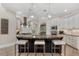 Beautiful kitchen with granite countertops, stainless steel appliances, and a large center island with seating at 6149 Blakeford Dr, Windermere, FL 34786