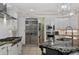 Spacious kitchen featuring a large island with granite countertops, a gas range, and stainless appliances at 6149 Blakeford Dr, Windermere, FL 34786