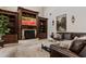 Beautiful living room with custom built-in shelving and a cozy fireplace, perfect for relaxation and comfort at 6149 Blakeford Dr, Windermere, FL 34786