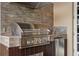 Outdoor stainless steel grill and sink set against decorative wood paneling at 6149 Blakeford Dr, Windermere, FL 34786
