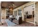 Outdoor living area with ceiling fan, brick flooring, and an outdoor kitchen at 6149 Blakeford Dr, Windermere, FL 34786