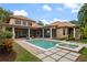 Gorgeous backyard featuring a sparkling pool, spa, and manicured landscaping at 6149 Blakeford Dr, Windermere, FL 34786