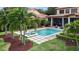 Inviting pool and spa surrounded by lush landscaping creating a private backyard oasis at 6149 Blakeford Dr, Windermere, FL 34786