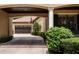 Portico with brick driveway, view of garage, mature shrubbery, and basketball hoop at 6149 Blakeford Dr, Windermere, FL 34786