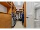 This closet offers built in shelving and storage and carpeted floors at 6149 Blakeford Dr, Windermere, FL 34786