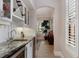 Wet bar offers granite counters, a wine rack, a sink, and wine storage at 6149 Blakeford Dr, Windermere, FL 34786