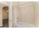 Bathroom featuring shower and tub combo and neutral-toned walls at 6335 Contessa Dr # 208, Orlando, FL 32829