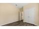 Bedroom with modern wood floors and closet at 6335 Contessa Dr # 208, Orlando, FL 32829