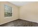 Neutral-toned bedroom featuring modern wood floors and natural light at 6335 Contessa Dr # 208, Orlando, FL 32829