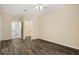 Bright bedroom featuring wood floors and an ensuite bathroom and closet at 6335 Contessa Dr # 208, Orlando, FL 32829