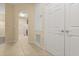 Hallway with tile flooring leading to the kitchen at 6335 Contessa Dr # 208, Orlando, FL 32829