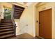 Hallway leading to unit 208 with a staircase at 6335 Contessa Dr # 208, Orlando, FL 32829