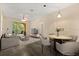 Bright living room features a dining area, comfortable seating, and balcony access at 6335 Contessa Dr # 208, Orlando, FL 32829