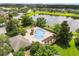 Aerial view of community pool surrounded by trees at 6335 Contessa Dr # 208, Orlando, FL 32829