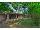 Home's backyard featuring large windows and door of an enclosed patio at 817 Big Buck Cir, Winter Springs, FL 32708