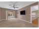 This bedroom features a ceiling fan, carpeted floors, and sliding glass doors to the porch at 817 Big Buck Cir, Winter Springs, FL 32708