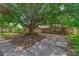 Traditional brick home with an expansive driveway, mature trees and landscaping creating great curb appeal at 817 Big Buck Cir, Winter Springs, FL 32708