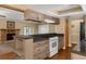 Eat-in kitchen featuring granite countertops, a center island, light wood cabinets and a white range at 817 Big Buck Cir, Winter Springs, FL 32708