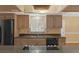 Updated kitchen with granite countertops, updated cabinetry, stainless steel appliances, and tile backsplash at 817 Big Buck Cir, Winter Springs, FL 32708