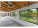 Enclosed patio featuring wood plank ceiling, ceiling fans, and large windows at 817 Big Buck Cir, Winter Springs, FL 32708