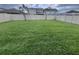 Large backyard offers plenty of space for recreation, fenced in for privacy, with new sod at 8348 Vivaro Isle Way, Windermere, FL 34786