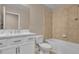 Modern bathroom featuring double vanity, tub, and tiled shower perfect for relaxing at 8348 Vivaro Isle Way, Windermere, FL 34786