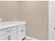 Bathroom featuring white cabinets, a quartz countertop, and updated fixtures, offering a clean and modern design at 8348 Vivaro Isle Way, Windermere, FL 34786
