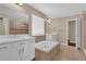 Bathroom with dual vanities, bathtub, and access to a shower stall at 8348 Vivaro Isle Way, Windermere, FL 34786