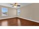 Bedroom with two windows and a ceiling fan at 8348 Vivaro Isle Way, Windermere, FL 34786