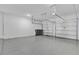 Clean, painted garage with high ceilings and garage door openers at 8348 Vivaro Isle Way, Windermere, FL 34786