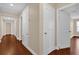 Hallway with hardwood floors, doorways, and neutral colors at 8348 Vivaro Isle Way, Windermere, FL 34786