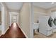 Well-lit hallway leads to the laundry room, with modern appliances and ample space at 8348 Vivaro Isle Way, Windermere, FL 34786