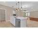 Bright kitchen with a center island sink and dining room in the background at 8348 Vivaro Isle Way, Windermere, FL 34786