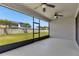 Screened lanai boasting beautiful views of the fenced backyard at 8348 Vivaro Isle Way, Windermere, FL 34786