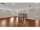 Loft area with hardwood floors and large windows for natural light at 8348 Vivaro Isle Way, Windermere, FL 34786