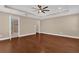 Spacious main bedroom with tray ceiling and en suite bathroom at 8348 Vivaro Isle Way, Windermere, FL 34786