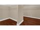 Spacious walk-in closet featuring hardwood floors and wire shelving at 8348 Vivaro Isle Way, Windermere, FL 34786