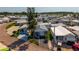 Aerial view showcases a neighborhood with charming homes, mature trees, and well-maintained landscaping, presenting a serene community at 9000 Us Highway 192 # 115, Clermont, FL 34714
